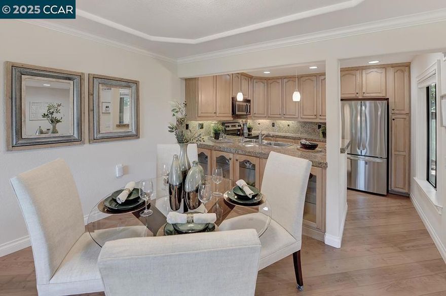 Beautifully remodeled Carmel model by Toupin, showcasing a stunning panoramic view of Mt. Diablo, welcoming Green Belt and the surrounding hills. This home has been thoughtfully updated from top to bottom, featuring elegant cabinetry, laminate flooring, and a gorgeous tile shower. Enjoy dramatic detailing throughout, including crown molding, smooth ceilings, and new adjustable-color LED recessed lighting in the kitchen. Convenient in-unit full-size washer and dryer. Nestled in the highly desirable Green Bell area of Rossmoor, this exceptional home combines modern comfort with breathtaking scenery, the perfect blend of style and serenity in this vibrant 55+ community.This is your new home in Rossmoor!