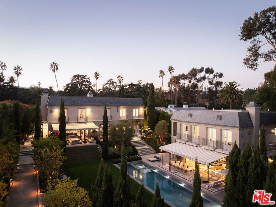 Welcome to 12770 S Bristol Circle an 11,800-SF, 7-bed, 11-bath Brentwood Park estate blending chateau-inspired architecture with chic modern style. Featured in Architectural Digest(Nov'21), this Studio William Hefner-designed home evokes Belle poque elegance. Inside, discover hand-selected marble, custom stonework, and lacquered finishes across a formal dining room, library, office, La Cornue kitchen, and family room. French doors flood the home with natural light. Upstairs, the primary suite offers dual marble baths, walk-in closets, a sitting room, and a private den. Lush grounds evoke the French countryside with manicured gardens, a pool, spa, bocce court, and winding paths. The gated lot includes an attached 2-car garage as well as a 3-story guest house with a kitchen, theater, speakeasy, wine cellar, and 2 ensuite bedrooms. Located in a premier school district near top shopping and dining, this private retreat is a timelessly chic Brentwood gem.