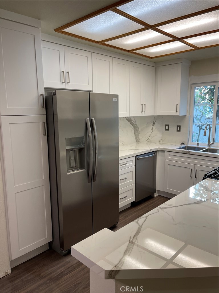 Welcome to Tijeras Creek Villas. This one is a beauty. Do you like remodeled? How about a new kitchen, new bathrooms, new paint, new flooring, new cabinetry, new countertops, new appliances (washer/dryer/refrigerator/stove included) and much, much more. You will love this one. The garage is walking distance to the front door, and the second guaranteed parking(carport) is not far away.