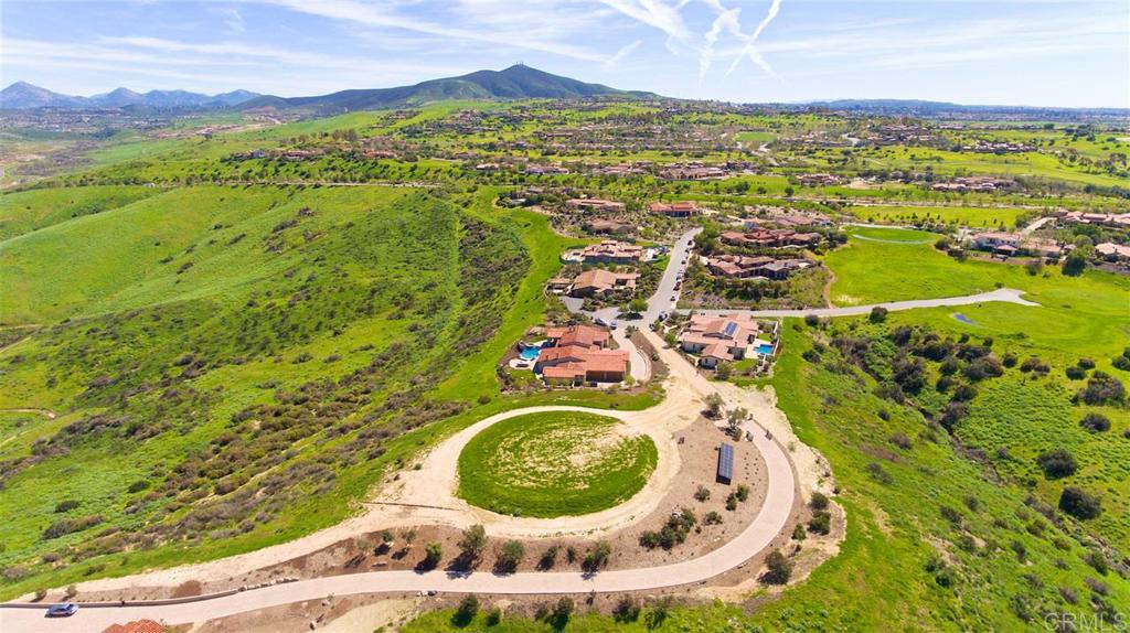 One of the Final Opportunities in Santaluz... Premium Homesite with Spectacular Views! Don’t miss one of the last remaining homesites behind the gates of the prestigious Santaluz community...a truly rare offering that hasn’t been available in years! This extraordinary lot at the end of the cul-de-sac is perched on a private hillside, capturing breathtaking, unobstructed vistas of Lusardi Creek, the surrounding valley, distant mountains, and vibrant sunset skies often dotted with hot air balloons. Enjoy 360-degree panoramic views and ultimate privacy on this expansive homesite. Whether you envision a sprawling single-level estate or a striking two-story residence, the flexibility is here: build up to 11,080 sq ft under roof, with 8,500 sq ft as a single level or 9,000 sq ft as a two-story home. Plans are available to help bring your dream to life. This is more than just land—it’s a once-in-a-generation opportunity to craft your custom sanctuary in one of Southern California’s most coveted golf communities. Don’t let this incredible opportunity slip away.