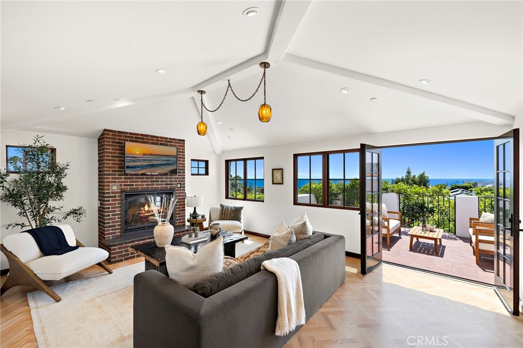 Step into a Mediterranean inspired sanctuary where timeless European elegance meets coastal California charm. Ideally located in the heart of Laguna Beach’s village, just moments from beaches, boutiques, and galleries. Thoughtfully reimagined with over $1 million in recent renovations, this 5 bedroom, plus office, 5.5 bath residence blends old world craftsmanship with refined modern living.
Enter through a sun kissed central courtyard, reminiscent of a Spanish Finca, and discover a home rich in curated detail. From hand carved mahogany doors to bespoke Siemon & Salazar lighting and antique accents. Globally inspired bathrooms feature handmade Moroccan zellige tiles from Antwerp, art deco Golem ceramics from Berlin, and honey onyx with Belgian glass in the master suite.
The kitchen and wet bar are as beautiful as they are functional, with Terra Bella terracotta tiles and a custom marine edge stainless steel counter evoking nautical elegance. The private garden offers a rare outdoor sink and prep station, perfect for al fresco entertaining.
On a 6,250 sq ft lot, the nearly 3,000 sq ft interior features oak herringbone floors, berber wool carpet in the bedrooms, and light filled spaces that capture the ocean breeze. This is a home where European sophistication meets laid back Laguna living.