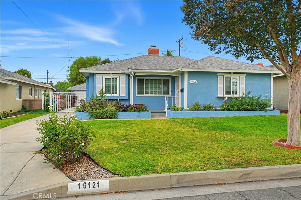 Welcome to 16121 Lisco Street, a beautifully updated three-bedroom, two-bathroom home in the heart of East Whittier that blends classic charm with modern comfort. From the moment you arrive, you’ll notice the fresh light-blue exterior paint, well-kept landscaping, and a long driveway leading to a spacious two-car detached garage offering great curb appeal and plenty of parking. Inside, the home feels warm and inviting with fresh Swiss Coffee interior paint and refinished hardwood floors that add timeless beauty throughout. Every room features new dual-pane windows, filling the home with natural light while keeping it quiet and energy-efficient. A brand-new central air and heating system ensures year-round comfort for your family.The home was professionally fumigated three years ago, giving you lasting peace of mind. One of the bathrooms has been completely remodeled into a spa-like retreat, featuring elegant porcelain tile, a soaking tub, a walk-in shower, and a modern vanity perfect for relaxing after a long day.The large living room offers the ideal space for family gatherings, entertaining guests, or enjoying cozy nights at home. Step outside to your huge private backyard, a blank canvas ready for your ideas create an outdoor dining area, plant a garden, or design a play space for kids and pets. The possibilities are endless. Located in one of East Whittier’s most desirable neighborhoods, this home offers thoughtful upgrades, true pride of ownership, and a convenient location near top-rated schools, parks, shopping, and dining. 16121 Lisco Street isn’t just a home it’s where comfort, beauty, and opportunity come together.