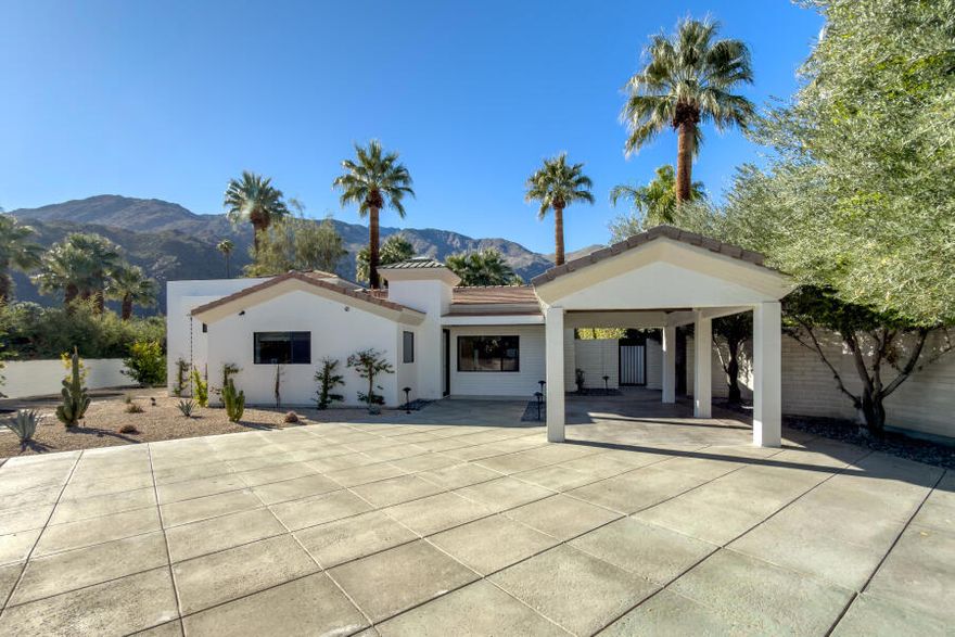 Welcome to a rare Old Las Palmas offering--currently the lowest-priced home among surrounding $7M+ estates. Just one block from downtown Palm Springs' renowned restaurants, shops, and entertainment, this historic neighborhood is celebrated for its welcoming community, neighborhood socials, and morning dog/people strolls.Privately gated, the property opens to a serene desert oasis featuring mature landscaping complemented by newer low-maintenance desert additions. This beautifully renovated residence blends old-world charm with modern sophistication and offers exceptional versatility ideal as a short-term rental, pied-a-terre, condo alternative, or legally expandable home.Enter directly into the living room, highlighted by soaring ceilings with exposed wood beams, modern lighting, and a cozy fireplace. The adjacent kitchen and dining area, visible through a classic serving window, overlook the saltwater pool, spa, and outdoor kitchen--creating seamless indoor-outdoor living perfect for entertaining.The home features two-bedroom suites plus a third bedroom currently used as an office. The elevated primary suite occupies the second level, offering breathtaking San Jacinto Mountain views, dramatic beamed ceilings, and private stair access to the backyard and pool. A guest suite is located on the main level, along with the third bedroom/office and powder room. A fourth bath serves the pool area and includes generous storage within a detached structure--offering potential for an ADU with city permits.Originally built in 1946 and extensively remodeled in 1993-1994, additional highlights include LED lighting throughout, custom cabinetry and countertops, wine cooler, newer sprinkler system, and a carport that could be enclosed to create a garage.A rare chance to own a thoughtfully updated desert retreat in one of Palm Springs' most prestigious neighborhoods.