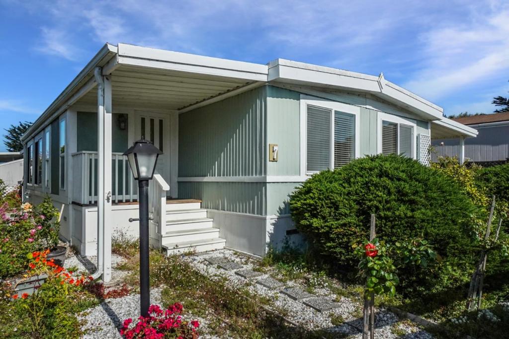 Live the coastal lifestyle in this charming 2-bedroom, 1-bathroom mobile home, ideally located in the desirable 55+ Canada Cove community just minutes from the beach in beautiful Half Moon Bay. Quiet park location. Step inside to find a light-filled sunroom perfect for morning coffee, a cozy living area, and a dining space with built-in cabinetry for added character and storage. Great yard space with a shed for storage or hobbies. Home is set in a peaceful, well-maintained neighborhood, where residents have access to resort-style amenities including a clubhouse, fitness center, and swimming pool. Prime coastal location, just moments from the ocean, scenic walking trails, golf courses, and downtown Half Moon Bay's vibrant shops and restaurants.
