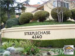 Gated Community of Steeplechase. 2 Bedroom, 2 Bath Ground Level Single Story end unit in prime location with easy access & parking for guests. Unit is located at end of cul de sac on Malibu Hills Road. Unit has been updated with granite counters in kitchen & newer kitchen appliances. There is a new refrigerator and a new dishwasher. There are two attached closed garages side by side and one enters directly into the unit. Additional parking pass for open parking provided. A Laundry room is in unit with hookups and rent includes a new washer and dryer. Enjoy a covered side patio with locked storage closet and a front patio. Fireplace is in living room.
There are 2 community pools with jetted spas, showering area, a barbeque area, workout room, community clubhouse, sauna, and security patrol. There is a bridge to walk to AE Wright Middle School from the complex. There is open area for hiking & it is close to a convenient shopping area with restaurants & stores. Floors are easy upkeep 18 inch ceramic tile. This is a very pretty complex with lots of open area. Approximately 8 miles to Malibu Beaches