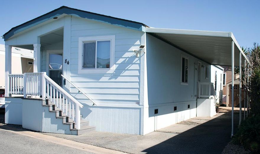 Discover Effortless Living at La Canada Mobile Estates  Welcome to 55 San Juan Grade Road #84, nestled in the sought-after 55+ community of La Canada Mobile Estateswhere simplicity meets comfort in a beautifully maintained neighborhood.  Built in 2004, this modern manufactured home blends thoughtful design with low-maintenance living. Step inside and experience 1,176 sq. ft. of bright, open space, enhanced by high ceilings and expansive double-paned windows that fill each room with natural light.  The seamless flow from the inviting family room to the dining area and open kitchen creates a sense of connection and warmthperfect for everyday living or entertaining. The primary suite offers a calm retreat, complemented by two additional bedrooms and a full hallway bath.  Enjoy added convenience with an indoor laundry room, private covered carport, and dedicated storage shed. This home also includes a refrigerator, washer, and dryer for a move-in-ready experience.  Located just minutes from shopping, dining, and local entertainment, this residence offers modern comfort, easy maintenance, and unbeatable value in one inviting package.  Experience the next chapter of easy living in Monterey County.