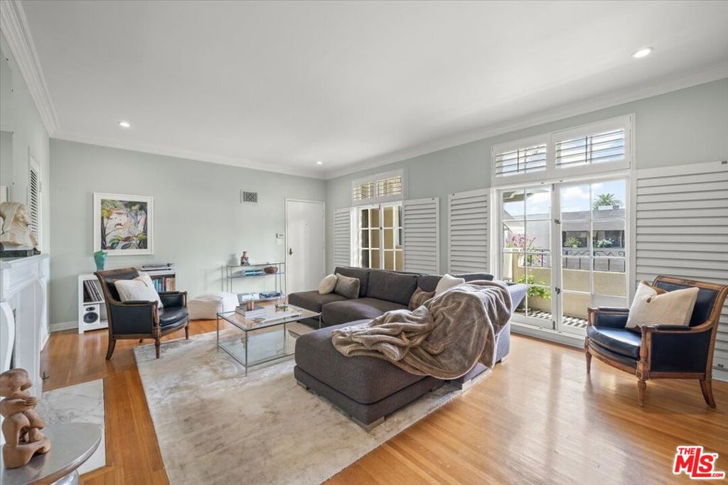 Located on the most elegant and desired street in Pasadena, this French Normandy style condominium building is surrounded by lushly landscaped, gated grounds. Personifying elegance and sophistication this second floor unit boasts elegant 9' ceilings, hardwood flooring and beautiful french doors and windows that afford views of the pool, spa and the treetops. The open and oversized living room features a south facing balcony and a decorative marble faced fireplace. The formal dining room leads to the sunny kitchen with a built-in oven, gas range, stainless steel refrigerator, plus a full size washer and dryer. The two large en suite bedrooms have ample closets with interior built-in cabinetry. Remodeled with luxurious finishes, both bathrooms are stylish and timeless. Each one features a steam shower, Italian marble and tile, and Brizo fixtures. A service door from the kitchen takes you to the two storage units, the community BBQ and the recently updated recreation room. The two side by side designated parking spaces are in the communal garage underground. Enjoy Old Town Pasadena and all it has to offer, the Rose Bowl and the Arroyo which are all within easy walking distance. Welcome home!