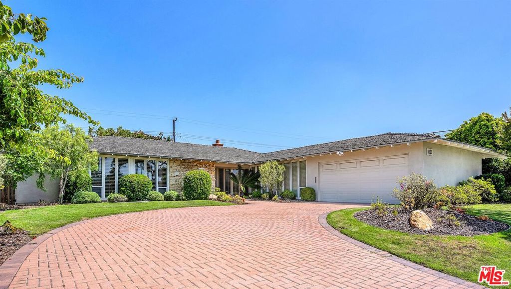 Mid-Century Modern Elegance Meets Tranquil Outdoor Living in Ladera Heights! Nestled in one of Ladera Heights' most desirable neighborhoods, this exquisitely maintained 4-bedroom, 3-bathroom single-family estate blends timeless design with functional luxury. From the moment you step inside, terrazzo and rich hardwood flooring set the tone, complemented by plantation shutters and a curated mix of premium vintage mid-century modern and recessed lighting fixtures. Each bedroom features custom California Closets, while a cedar-lined hallway closet adds a refined touch. The primary suite is a private sanctuary, boasting a sunken shower and serene ambiance. The chef's kitchen is a culinary dream, showcasing granite countertops, stainless-steel stove, oven and refrigerator, vertical pull-out spice cabinet, shallow pantry wall, and bespoke cabinetry that flows into the adjoining family room. Additional interior highlights include a separate laundry room with sink and abundant storage, vintage Japanese hanging hallway screens, and a custom-crafted Japanese Tansu cabinet an artful nod to heritage and design. Stay comfortable year-round with central heating and air conditioning managed by a Nest smart thermostat. Step outside to an entertainer's paradise: a fully equipped outdoor kitchen island with dual gas BBQ grills, a sparkling pool with removable safety fencing, automatic sprinkler system, and a professionally designed garden oasis. The landscape is adorned with Japanese Maple, Bamboo, Ginkgo, and mature Plumeria trees, along with fruit-bearing Fig and Lemon trees, a Japanese stone lantern, and a raised vegetable bed for farm-to-table living. Rounding out the estate is a two-car garage with epoxy flooring and custom cabinetry ensuring form meets function at every turn. Don't Miss this unique opportunity!