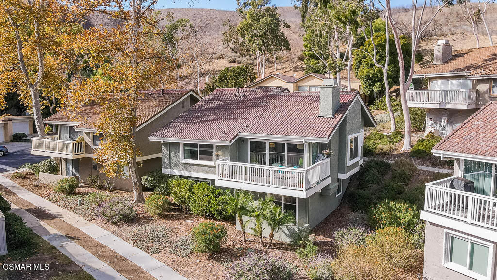 Stunningly remodeled home in Oak Park's Country Vista Community. With a possible 5th bedroom, this turn key home features vaulted ceilings, spacious open floor plan, abundant natural light and breathtaking views of the mountains. You will feel like you are on a vacation every day. There are two bedrooms upstairs and two bedrooms plus bonus room downstairs. The spacious, open, kitchen features quartz countertops. All of the bathrooms have been updated with new countertops and fixtures. The gorgeous Living room features an upgraded fireplace, and large deck with amazing views right off the living room. Nest thermostat, private two-car garage, in-unit laundry, access to community pool and tennis courts and conveniently located close to shops and award winning schools. You don't want to miss this highly desirable home. Call on small pets.