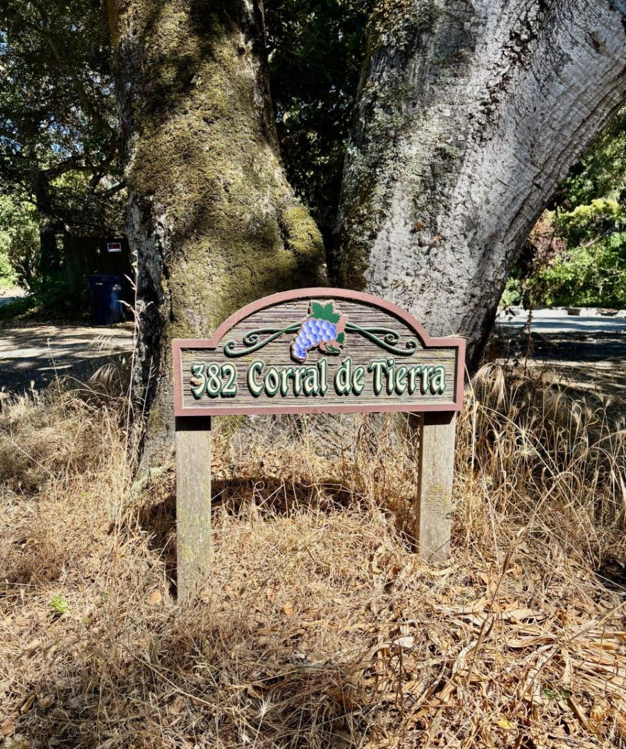 Beautiful, sunny and serene describes this easily buildable 1.27 acre lot along coveted Corral de Tierra. House foundation and garage slab are still standing and look to be in good condition after house burned down in April, 2025. This foundation supported a 3 bedroom, 2 bathroom, 1,324 sq. ft. single-level house with a 20'x26' garage. Small green shed can be seen through the lush trees and thick vegetation on hillside behind. Great opportunity to build the home of your dreams in such a lovely location. Circular dirt driveway in front for ease of parking. Septic, water tank propane tank and well seem to have not been affected by fire. Lot extends approximately 3/4 of the way up the hillside behind and there is a seasonal creek that runs in the gully between the yard and the hillside.