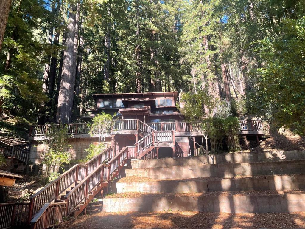 Original custom built home on just under 2 acres of land. Nestled in the desirable West Park neighborhood, just five minutes to downtown Boulder Creek. This could be a fun project to renovate with the remaining ornate wood finishes, stained glass, open beamed ceilings and custom/antique fixtures! Solid wood doors, brass hardware and three fireplaces. Expansive lot is set back just enough for solitude in nature and privacy. Don't miss this unique relic! Buyer to verify all information.