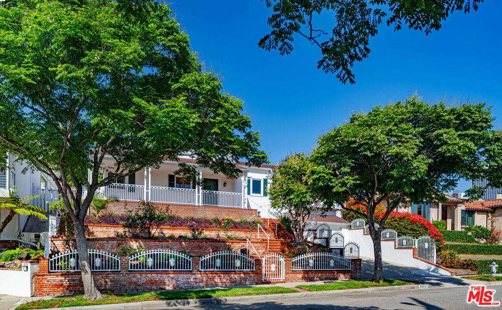 Situated in the prestigious area of South Beverly Hills, this home has stunning views of LA! Centrally located, the home is near Roxbury Park, golf courses, Avenue of the Stars, Westfield Century City, Fox Studio Lot & Beverly Hills High School. Featuring 3 bedrooms, 4 fully remodeled baths with vaulted ceilings in the living & kitchen, spacious chef's kitchen with stainless Thermador appliances, wood burning fireplace, office/den, stone & wood flooring throughout. The primary bedroom has amazing views, walk-in closet & en-suite bath with steam shower. The private backyard is perfect for entertaining with a large patio, pool/spa + pool bath. The 2-car garage + driveway & large separate utility closet allow for ample parking and storage. With world-class dining, shopping and entertainment at your fingertips, this home is the ultimate in convenience, comfort & true Beverly Hills lifestyle!