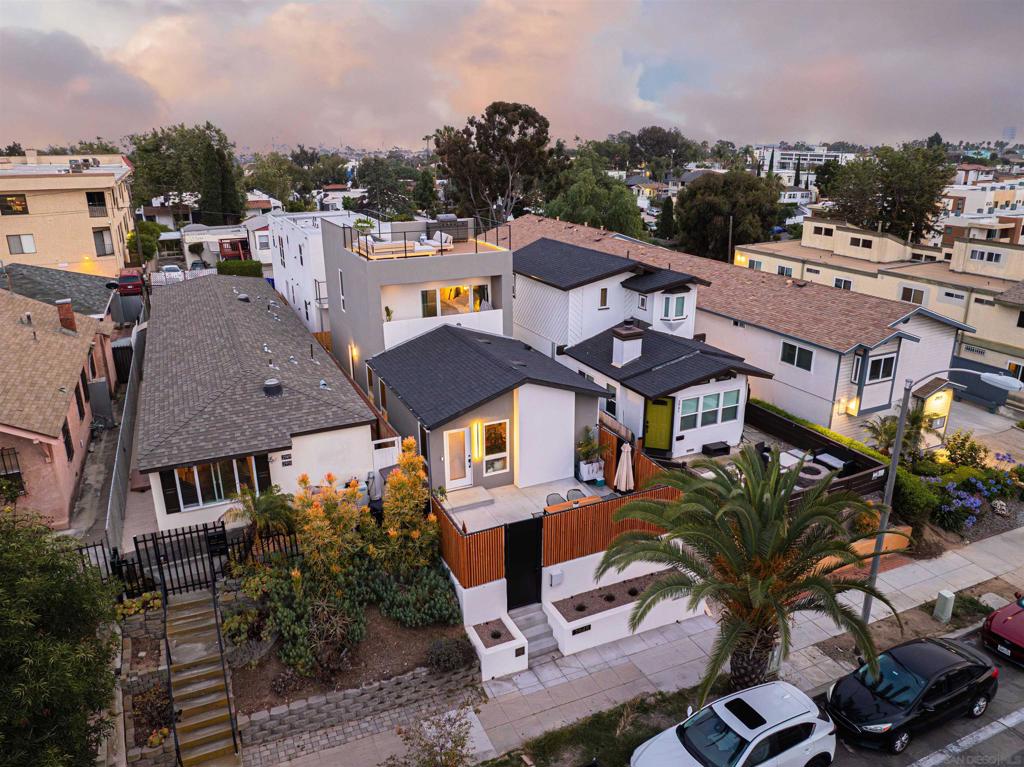 Welcome to an exceptional opportunity in the heart of Golden Hill, where modern design meets urban convenience! A brand-new multi-unit property that offers versatility, style, and income potential that is perfect for savvy investors or homeowners looking to live in luxury while generating passive income. The front unit is a spacious 3-bedroom, 2-bathroom home featuring its own private entrance and a spectacular rooftop deck with breathtaking panoramic views of downtown San Diego make it the perfect spot to unwind or entertain under the city lights. Behind the main residence, you’ll find three separate 1-bedroom, 1-bathroom units, each designed with care and quality finishes to attract excellent tenants and ensure maximum comfort and appeal. Located in one of San Diego’s most desirable neighborhoods, you’ll enjoy walkable access to local restaurants, parks, and downtown San Diego. Whether you’re expanding your real estate portfolio or dreaming of a versatile property with rental income, this gem in Golden Hill checks every box.
