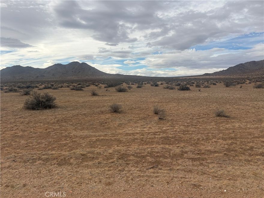 Experience the quiet beauty of desert living on this 5-acre parcel of raw land, surrounded by wide-open space and striking mountain scenery. This peaceful location offers the perfect escape from the busyness of city life, giving you room to spread out, breathe in the clean open air, and enjoy the natural calm of the landscape. Whether you're looking to build a private retreat, invest in land, or simply enjoy the serenity of the desert, this spacious property provides endless possibilities and a truly tranquil setting.