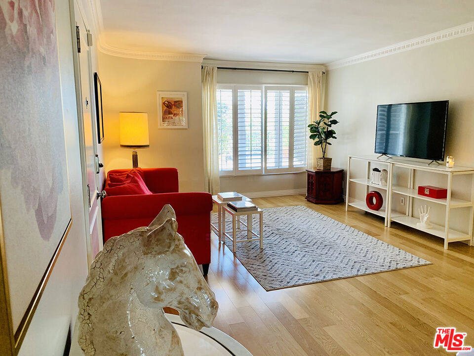Chic, cheerful, tastefully redone unit at Sunset Plaza Terrace Condominiums!!! Wide plank hardwood floors throughout, upgraded kitchen and bathrooms, interior laundry with Miele equipment, and more! Deluxe LG door-in-door refrigerator. 2 bedrooms, 2 baths. Central HVAC heating and AC. 2nd service entrance in kitchen. Swimmers pool and spa, surrounded by verdant trees and landscaped brick terraces. Gated security building. An artistic, quiet sanctuary just above Sunset Plaza, and the world famous Sunset Strip! Walking distance to shops and restaurants! A very high condition unit in one of the great buildings just above the Strip!!