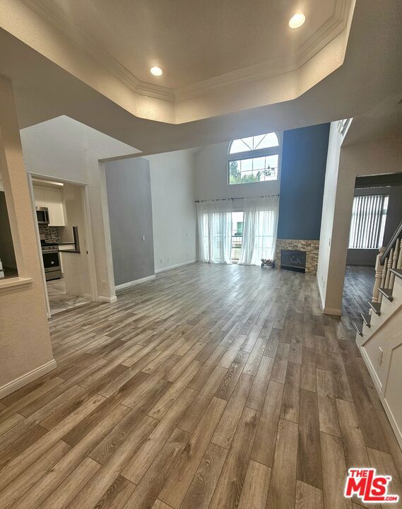 Absolutely stunning penthouse residence with soaring ceilings and abundant natural light, located in the heart of Sherman Oaks. This rare offering features 3 true bedrooms, a loft, and 2.5 bathrooms in a desirable resort-style community with pool, spa, and BBQ area. Step inside to find freshly painted interiors, wide-plank wood-style floors, and recessed lighting throughout. The inviting living room boasts a cozy fireplace and opens seamlessly to a private balcony, perfect for relaxing or entertaining. A formal dining room flows into the updated kitchen, appointed with quartz countertops, stainless steel appliances, and a charming breakfast nook. Convenient in-unit laundry room with washer/dryer and storage sits just off the kitchen. The primary suite offers a spacious walk-in closet, additional wardrobe space, and a beautifully updated bath with dual vanities. Two secondary bedrooms share a Jack-and-Jill bathroom.Upstairs, the versatile loft with wet bar opens directly to a private rooftop patio an ideal spot for al fresco dining or sunset views. Additional highlights include: Central A/C and heat, Refrigerator, washer, and dryer included. Two side-by-side parking spaces in a secure subterranean garage. All within close proximity to Ventura Boulevard's best shops, restaurants, and markets, with easy access to major freeways. This home truly combines luxury, comfort, and convenience in one of the Valley's most sought-after neighborhoods.