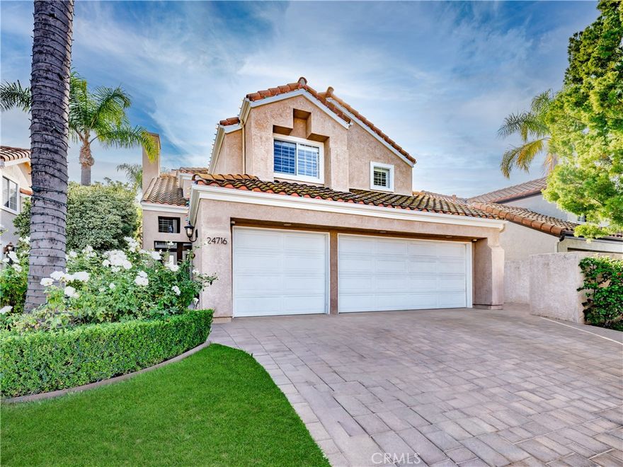 Welcome to 24716 Calle Altamira, a bright and inviting residence located within the guard gated Calabasas Hills Community. This 2,362 square foot single family home offers three bedrooms, three bathrooms, plus a dedicated office or gym, providing a flexible and highly functional layout ideal for everyday living. Upon entry, the home opens to a dramatic two story living room filled with natural light. Dark wood flooring, oversized windows with custom plantation shutters, and a warm fireplace create an inviting and elegant first impression. The open layout allows for seamless flow between living spaces while maintaining comfort and purpose throughout the home. Adjacent to the living room is a formal dining area ideal for entertaining. The spacious kitchen is thoughtfully designed with granite countertops, stainless steel appliances, double ovens, ample cabinetry, and a generous peninsula for prep and casual seating. A charming breakfast nook sits just off the kitchen, surrounded by windows overlooking the backyard. A separate family room provides an additional living space featuring a second fireplace, built in media area, and direct backyard access. The main level also includes a dedicated laundry room, a powder room, and direct access to the three car garage. Upstairs, the primary suite serves as a peaceful retreat with vaulted ceilings, plantation shutters, and abundant natural light. The en suite bathroom features dual vanities, a soaking tub, separate shower, and ample storage. Secondary bedrooms are generously sized, including one with custom built in shelving and window seating. The backyard is designed for both relaxation and play, offering a built in BBQ, lush landscaping, grassy area, and private playground. Gardening service is included. Residents enjoy HOA amenities including a pool, spa, and private park. Located within the highly regarded Las Virgenes School District and less than one mile from The Commons at Calabasas, Calabasas Lake, shopping, dining, and the farmers market, with easy access to the 101 freeway and Malibu beaches. This is a rare opportunity to lease a well maintained home in one of Calabasas’ most desirable communities.