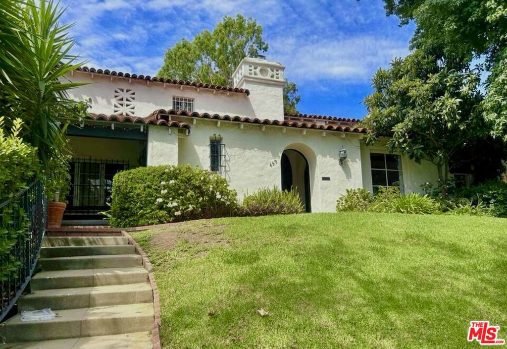 Welcome to 459 N. Orange Dr a beautifully updated Spanish-style gem in one of Hancock Park's most sought-after pockets. This stunning residence offers timeless charm with modern comforts, featuring 3 spacious bedrooms, 2 elegantly remodeled baths, and an open-concept living and dining area flooded with natural light. The updated kitchen boasts custom cabinetry, high-end appliances, and designer finishes. Step outside to a private backyard oasis, perfect for entertaining or relaxing under the stars. Located on a tree-lined street just moments from Melrose, Larchmont, and The Grove, this home offers the perfect blend of classic Los Angeles character and contemporary lifestyle.