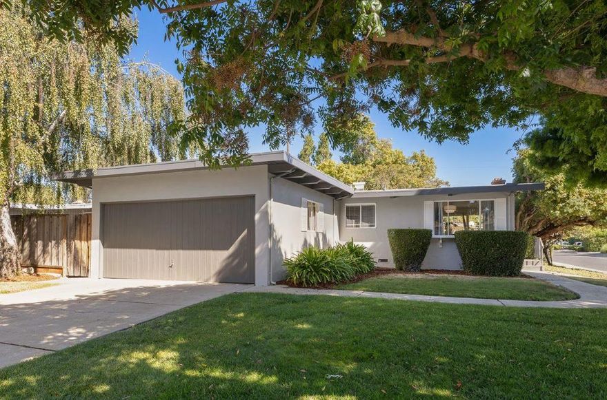 Nestled in the desirable Monta Loma neighborhood of Mountain View, this charming move-in ready home blends comfort, light, and style. The open and airy floor plan showcases high beamed ceilings and large windows that fill the home with natural light throughout the day. The spacious living room includes a cozy fireplace, a large sliding glass door leading to the outdoor space, and a formal dining area conveniently located next to the kitchen - perfect for everyday living and entertaining.This lovely home offers 3 BR, 2 baths, and a two-car attached garage. All bedrooms are ideally situated toward the back of the home for added privacy. The primary suite enjoys direct access to the peaceful backyard, while the 2nd BR overlooks the lush garden. Step outside to a private backyard oasis, perfect for gardening, family gatherings, or quiet relaxation. A prolific grapefruit tree adds charm and seasonal delight, offering fresh fruit right from your own garden. Ideally located just minutes from shopping, dining, and local parks, with easy access to Caltrain, major highways, and public transportation, this home offers both tranquility and convenience. Close to Google and other leading tech companies, and with the top-rated Los Altos High School, its a wonderful place to call home.