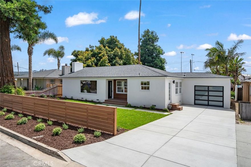 Welcome to 432 California - a stunning single level ranch-modern home plus detached guest residence in the heart of Arroyo Grande, walking distance to The Village of AG and AG High School. This is a rare opportunity to purchase a completely turn-key home with designer features & finishes in a coveted historic neighborhood. The main residence is a reimagined 1950s era 3 bedroom 2 bath featuring an oversized living room with wood burning fireplace, gourmet kitchen, separate butler’s pantry and laundry room, primary bedroom suite with dual vanity & soaking tub + tiled shower, additional full bathroom for guests, two guest bedrooms, attached one car garage, expansive real wood deck facing the backyard, and a covered front porch wrapped in wood opening up to the front lawn. The guest residence structure was built in 2003 and features an open concept living/dining/kitchen area with a private bedroom suite and dedicated laundry and a full bathroom. This unit features a bi-folding accordion door system that opens up to the backyard and dedicated mini-split system for cooling and heating. The quarter-acre lot size is large enough for multi-generational living or income opportunities with plenty of space to fence off the backyard to create a more private guest residence experience. Other features/finishes include: Brand new luxury vinyl plank throughout, brand new custom cabinetry, premium stone countertops, designer tile in kitchen and bathrooms, modern cabinet and door hardware, custom crafted open shelving, brand new concrete driveway and concrete hardscaping, genuine grass lawn in the front and backyard, dozens of new outdoor plants and brand new drip irrigation, and more. This is truly one of the most unique and functional home offerings currently for-sale in the city of Arroyo Grande.