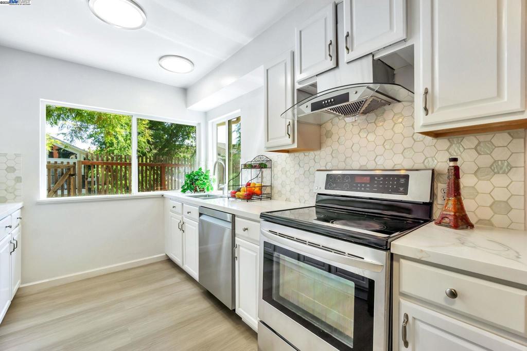 Brand New remodeled kitchen and floor! Beautifully updated 4 beds, 2.5 baths townhome in Walnut Creek’s sought-after Heather Farms community. This home features fresh paint the whole house and doors, brand new kitchen quartz counterop, Stainless Steel double sink and faucet, full elegant backsplash, stainless steel Appliances, brand new LED lights, newer dishwasher, hood, a cozy living room with fireplace, large sliding door, plenty of large dual-pane windows enhanced natural light throughout. Large primary suite with two large windows offers lots of morning light and mountain view, walk-in closet and updated ensuite bath with jetted bathtub. Large spacious second bedroom has two large windows with lot of sunlight in afternoon, mirrored closet door. Brand new vanity in downstair bathroom. Central heat & A/C, in-unit laundry, and an attached 2-car garage. Enjoy front private court yard and sunny backyard for outdoor living perfect for entertaining. Many fruit trees and flowers. Located in a quiet cul-de-sac, the home is part of a well-maintained HOA with pools, tennis courts, trails, and clubhouse access. Conveniently close to golf course and Heather Farm Park, shopping, dining, BART, and top-rated schools in the Northgate area.