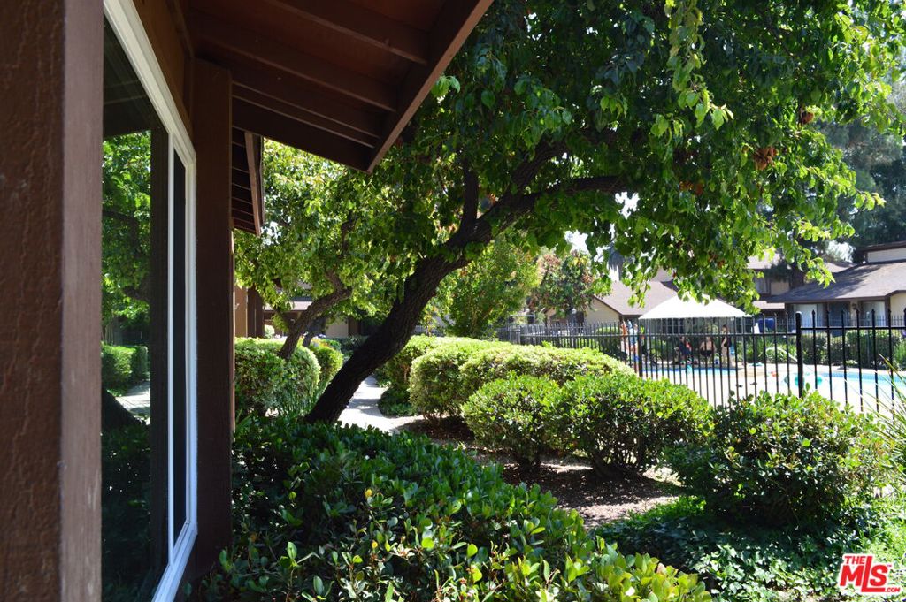 Welcome to this beautifully maintained and spacious 2-story townhouse nestled in one of Panorama City's most desirable gated communities! Offering 3 generously sized bedrooms upstairs plus a versatile bonus room downstairs and 3 full bathrooms, this home provides 1,345 sq ft of comfortable, well-designed living space. The primary suite features a private balcony, perfect for morning coffee or evening relaxation, while the open-concept living and dining areas are filled with natural light and enhanced by central heating and air conditioning for year-round comfort. The kitchen opens via sliding doors to a large, private patio ideal for entertaining, BBQs, and outdoor living, with direct access to a 2-car side-by-side garage equipped with laundry hookups. Residents enjoy resort-style amenities including 2 sparkling swimming pools, rejuvenating spa, and a picnic area, all within a secure, gated complex with lush landscaping and beautiful curb appeal. Conveniently located near Sepulveda Recreation Center, Panorama Mall, public transportation, and the I-405 Freeway, this location offers both accessibility and tranquility. Don't miss this incredible opportunity to own a charming home in a thriving and well-maintained community. Schedule your showing.