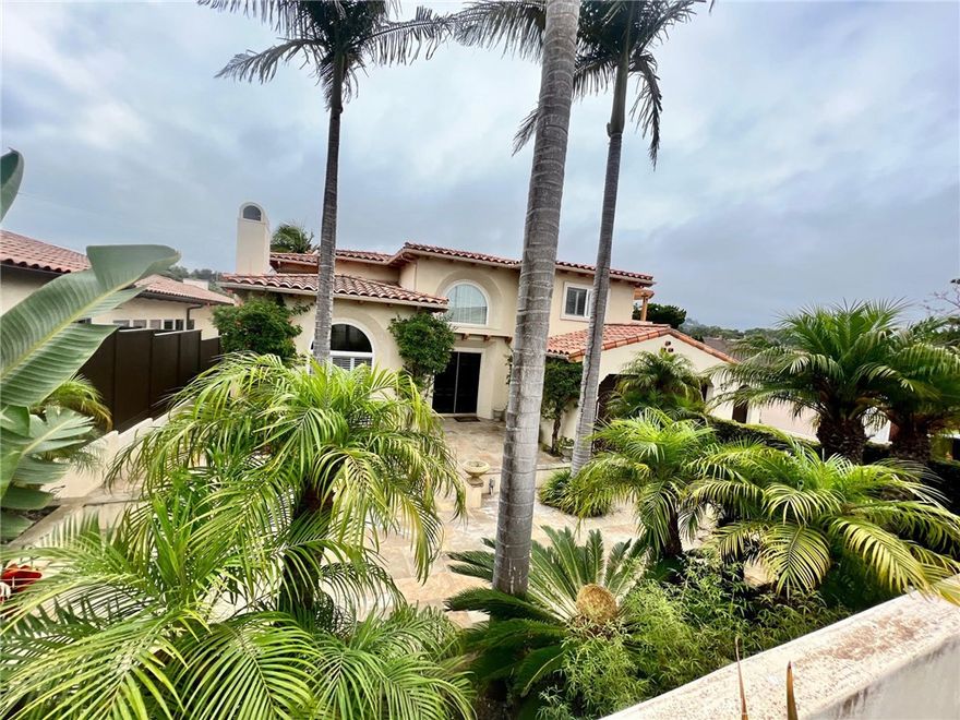 A Mediterranean beauty, at the peak of Hollywood Riviera Hills on a quiet tree lined street, views of Palos Verdes Estate Hills and peekaboos of Ocean from the top. Large, private, and sunken lot with multiple outdoor entertainment levels, totaling approximately 7,000 +- SQFT of usable living and entertaining space. Travertine and hardwood throughout, with a large kitchen with cooking island, and stainless steel appliances. Recessed ceilings and lighting, open, bright and grandly spacious feel. Formal living room, formal dining room, large sunny den, and a breakfast nook next to kitchen.... Outdoor kitchen with dual refrigerators, gas grill, charcoal grill, and covered pergola with romantic outdoor dinner seating for 12! Multiple courtyards, 2 equipped with stone outdoor fireplaces! Outdoor rotating lounge diner for rainy days...Wood burning Tuscan Pizza Oven..Two separate wine cellars for 2000+ btls. and wine tasting room. Too much to list...Don't miss on this special and rare listing.