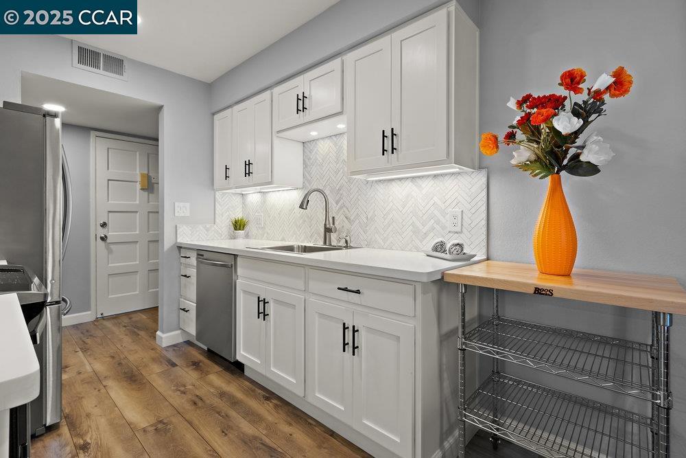 Welcome to 825 Oak Grove Road, Unit 29, a beautifully updated 2-bedroom, 1-bath condo offering 922 square feet of modern living space in a desirable Concord location. This light-filled lower-level unit has been thoughtfully renovated throughout, blending comfort, style, and functionality. The kitchen features modern cabinetry, updated countertops, beautiful herringbone backsplash, and newer appliances, while the bathroom has been re-imagined with contemporary finishes. Additional upgrades include wide-plank LVP flooring, dual-pane windows, a dual-pane sliding glass door, a newer HVAC system, and the convenience of in-unit laundry, a rare find in a condo. Step out onto your private patio to enjoy peaceful outdoor moments, or head out and take advantage of the unbeatable location. You’re just minutes from BART, ideal for commuters, and within close proximity to shopping centers, grocery stores, and a variety of medical and dental offices. This well-maintained community offers reserved parking and is surrounded by mature trees and green space, creating a tranquil setting right in the heart of the city. Whether you’re a first-time buyer or a downsizer, this turnkey condo offers the perfect blend of lifestyle, location, and low-maintenance living.