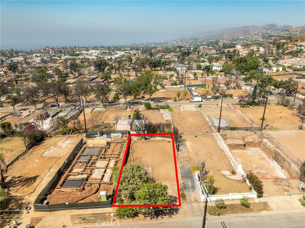 Buildable lot for sale! Seller will consider carrying note. In the magical community known as The Alphabet Streets. Within walking distance to the beloved Palisades Village and other local community offerings (The Village is on it's way to reopening as projected in early 2026) Adjacent to Will Rogers State Park another beloved preserved historic location that was enjoyed by many visitors for various activities including Polo. This great park will also become great again. The property sits in a community that has strong intention and purpose and like the Banyan tree in Lahaina the ashes of this community like the Phoenix will rise once again and be as strong or stronger. The property was owned by the same couple for over 50 years. It is offered with the blessing someone will also build roots and enjoy the full life that they enjoyed here. We hope whoever builds and resided here feels that good will. Se video for proximity to of property location in relation to Palisades Village
