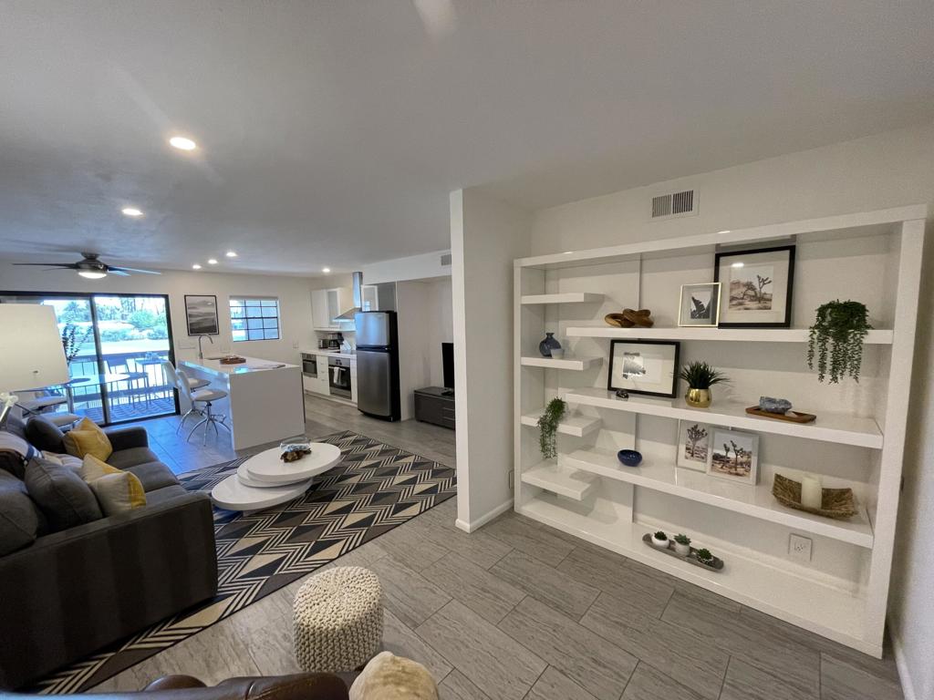 Furnished 1 Bedroom plus Den/Office area and 1 Bath long term Lease. Beautifully remodeled condo with a contemporary modern desert design. Long-term Lease (12 months or longer) $1,850 per month -OR- Seasonal rental turnkey furnished. Available from November 2025 into 2026 at $3,100.00 per month. Wonderful open concept living with balcony and views looking out to the Tahquitz Creek Golf Course. The kitchen features a large island with seating, stainless steel appliances and a wine refrigerator. The balcony includes a full size Washer and Dryer behind sliding doors. Enjoy BBQing and dine al fresco while watching the golfers.. which can be very entertaining! Despite its modest size it does not compromise on comfort and style. The setting is gorgeous and the location couldn't be more ideal. The community of Palm Springs Golf & Tennis offers 3 Pools, 4 Spas, Tennis Courts, Pickle Ball and a Clubhouse. Walking distance to Trader Joes, restaurants, Starbucks, Vons and more.. It's also just a short drive to downtown Palm Springs. Don't miss this one!
