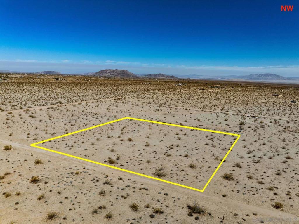 This 2.29-acre off-grid property in Joshua Tree, San Bernardino County, CA offers a peaceful desert retreat with direct dirt road access! The lot provides ample space for recreation, a weekend escape, or a future build with wide open views and privacy. Ideal for those seeking quiet and nature, this land sits away from city noise but within reach of unique local landmarks. It’s located near the Noah Purifoy Outdoor Desert Art Museum, SkyRanch Joshua Tree, and Copper Mountain College. Joshua Tree National Park is just a short drive away for hiking and sightseeing. The nearby communities of Joshua Tree and Yucca Valley provide shopping, dining, and essentials. A great spot for those looking to enjoy desert living surrounded by local art, culture, and natural beauty!