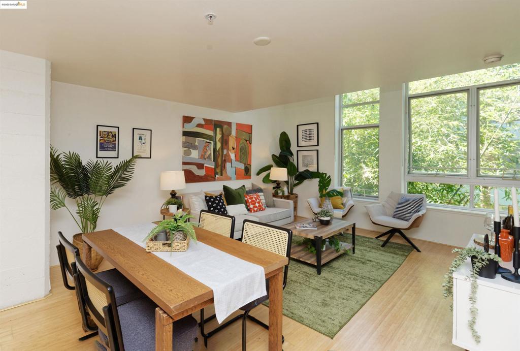 LIVE-WORK-PLAY-ENJOY! A Rarely available unique 1 bedroom, 1 bathroom bright and Sunny Courtyard Loft end unit at Pacific Cannery Lofts the Award Winning Rick Holliday-David Baker and Partners Gated historical community located in West Oakland. Don't miss this incredible opportunity to enjoy all the advantages of living in this cute end unit loft with lush courtyard views from the soaring floor to double ceiling windows and lots of natural sunlight. First floor open concept living with a modern kitchen that has all stainless appliances, Corian countertops, plenty of counter space for the cook, living room - dining area has great lush landscaping view. Lovely Bamboo flooring throughout. Upstairs Primary bedroom can easily accommodate a king size bed and has a huge closet with great custom built-ins. Fabulous separate flex space perfect for Home Office, Exercise area, Nursery and more! In-unit washer- dryer. Convenient location with easy commute, Low HOA, Pets OK and just a stone's throw from Emeryville, San Francisco, Downtown Oakland, Bart, freeways, bike paths. One assigned covered parking space with EV charger in gated garage. Secure bike room & dog washing station too. Vacant and easy to show.