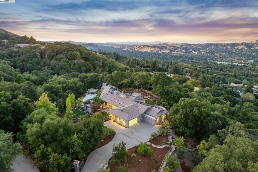 Private Hillside Retreat Located on Approximately 9 Acres in Westside Danville with 360-Degree Views of Mount Diablo & Las Trampas Ridge. Immediate Access to Las Trampas Regional Park with Over 5,000 Acres of Hiking Trails. Single Level Ultra-Private Gated Estate Designed by Architect Max Jacobson & Crafted Over a 5-Year Span. Architecturally Refined Home Unmatched in its Meticulous Care & Quality. Modern Architecture & Superior Finishes Throughout Including: Western Hemlock Vaulted Ceilings, Oversized Windows Presenting Incredible Views from Every Room, Refinished Oak Hardwood Floors, Updated Kitchens with New Counters & Appliances, Updated Bathrooms, Solid Wood Doors, Surround Sound & More. Secondary Butler's Kitchen with Adjoining Outdoor Pergola with Built-In BBQ Area & Fireplace. Heated Infinity Edge Pool & Spa with Water Features Overlooking Las Trampas Ridge Plus Detached Pool House with Full Bathroom & Changing Room. Fenced Grounds Including Walking Paths, Waterfall, Fruit Orchard, Greenhouse, & Raised Beds. Owned Electrical Solar with Generator. Ample Space to Accommodate an Adjacent ADU. Private yet Convenient Westside Danville Location Approximately 1.2 Miles from Downtown Danville. Views:  Ridge