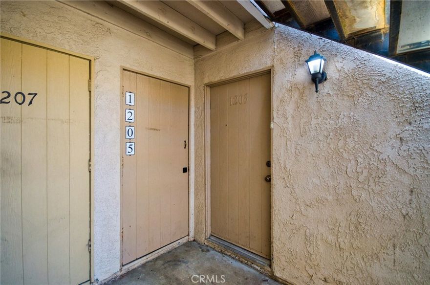 Lower level unit with 2 bedroom/ 1 Full bath. Upgraded kitchen and bath. New Laminated wooden floor installed in bedrooms. Close to parking and near pool area. Open floorplan with private patio. Spacious bedrooms with large closets and plenty of storage. Cinnamon Tree amenities include pool, spa, barbeque area, club house and laundry. Conveniently located across from the Placentia Civic Center, Police Station and Public Library. Alta Vista Country CLub, parks, schools, shopping and 57/91 freeways are all nearby. HOA fees include water, sewer, and trash.