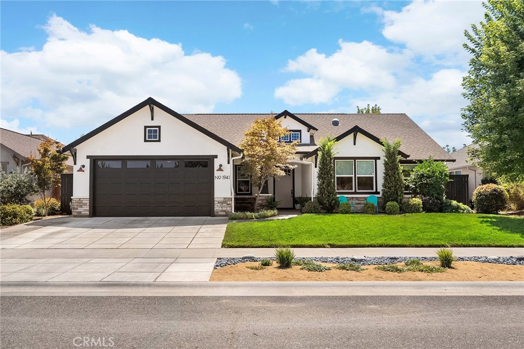 Welcome to 1941 Waxwing Way, a Shastan-built masterpiece where modern upgrades meet timeless craftsmanship. This 3-bedroom, 3-bathroom home spans 1,980 sq. ft. and was designed with comfort, efficiency, and entertaining in mind. Thoughtfully upgraded with a 2024 solar system under the NEM-2 program, smart thermostat, and smart irrigation, it’s as practical as it is beautiful. Step inside and you’re greeted by soaring ceilings, warm natural light, and an open layout that brings everyone together. The spacious living room features a stunning stone fireplace with a liquid amber hearth, creating the perfect setting for cozy nights in. Flowing seamlessly into the kitchen and dining area, this is the heart of the home. The chef’s kitchen is both stylish and functional, showcasing granite countertops, a striking concrete island, subway tile backsplash, stainless steel appliances, a 5-burner gas range with pot filler, and a walk-in pantry to keep everything organized. Whether it’s a quiet family meal or holiday hosting, this space was made to impress. The split floor plan ensures privacy for all. The primary suite is a true retreat with private backyard access, a walk-in closet (recently finished with custom cabinetry and pull-outs), and a spa-like bathroom featuring a soaking tub, dual sinks, heated tile flooring, and a walk-in shower with dual shower heads. The two guest bedrooms are generously sized with blackout blinds and updated finishes, while two additional bathrooms, each beautifully appointed, offer convenience for family and guests. A dedicated laundry room with a mop sink, solar tube skylight, and abundant storage adds to the home’s thoughtful design. But it’s the backyard that steals the show. Step outside through oversized sliders to a private paradise designed for year-round enjoyment. The expansive pergola with retractable shades creates the ultimate outdoor living room, complete with pre-wired sound, misters, and gas plumbing for your BBQ and firepit. Host poolside gatherings by the sparkling 18,000-gallon in-ground pool with jump rock, relax in the evening under uplighting that highlights the mature trees, or tend to your garden beds with the convenience of a drip system. Whether entertaining a crowd or enjoying quiet evenings, this backyard is second to none. 1941 Waxwing Way isn’t just a home,it’s a lifestyle. With modern efficiency, timeless design, and an entertainer’s dream backyard, this Shastan stunner is ready to welcome its next chapter.