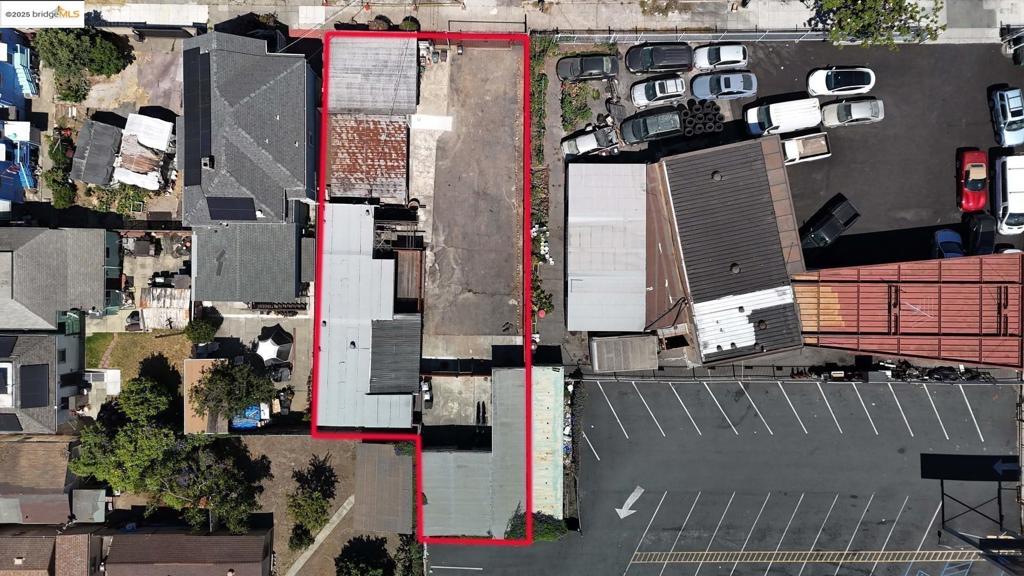 Two adjacent lots with mixed residential and commercial zoning. Both lots are zoned for affordable housing. Use the long lots and included four shipping containers to store your contractor equipment, vehicles, or anything else you might need. The combined lots are around 5,725 sq ft. located in a quiet, mixed-use neighborhood. There is also a mobile home with one bedroom, two bathrooms, and two kitchens, making this property perfect for someone interested in a live/work situation. Seller has made over $35k worth of improvements over the past 7 months.