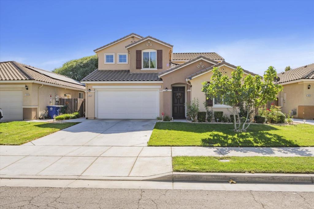 Welcome to your future home in the desirable Southside of Los Banos! This expansive 2,783 sq ft residence offers the perfect blend of style, comfort, and functionality with 5 bedrooms and 3.5 bathrooms. Step inside to find a thoughtfully designed layout featuring a spacious family room with soaring ceilings, creating a bright and inviting atmosphere for gatherings. The chef-inspired kitchen boasts granite countertops, a large island, gas cooktop, microwave, pantry closet, and a breakfast bar, making it ideal for both entertaining and everyday living. Enjoy the beautiful combination of carpet, hardwood, and tile flooring, adding elegance throughout. Additional upgrades include tile roofing, tile floors in the kitchen, entry, and baths, a fire suppression system, and front yard landscaping with a fully fenced backyardall included in the price! For your comfort and convenience, this home also features central AC and heating, a utility room for in-home laundry, and a two-car garage. Located within the Los Banos Unified School District, this property offers an excellent setting for families. Dont miss this opportunity to own a stunning, upgraded home in one of Los Banos most sought-after neighborhoods. Schedule your tour today!