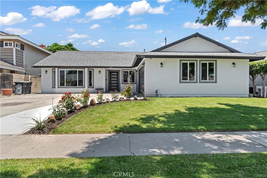 Absolutely Stunning Single-Story Home. This recently renovated kept and well single-level residence features a spacious Great Room-style floor plan, loaded with modern amenities and stylish finishes throughout.
Offering 5 bedrooms and 3 full bathrooms, this home includes two bedrooms with private en-suite baths—ideal as dual primary suites. The remaining three bedrooms share a beautifully upgraded hallway bath. All bathrooms are finished with quartz countertops, decorative glass tile accents, and modern glass enclosures—one with sleek frameless shower doors.
Gourmet kitchen, boasting elegant quartz countertops, abundant cabinetry with soft-close doors, recessed lighting, and decorative pendant lights above a large center island. A deep farmhouse sink complements the premium stainless steel “Café” appliance suite, which includes a refrigerator, 36” stove with vent hood, microwave, dishwasher, and a built-in wine cooler.
The inviting living area features a contemporary electric fireplace with a rustic wood accent mantle and is pre-wired for a wall-mounted TV—no messy cords in sight. Vaulted ceilings and recessed lighting add to the open, airy feel of the home.