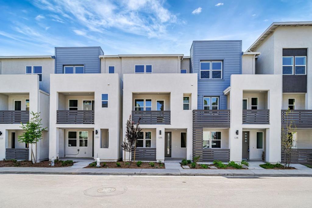 This Towns Plan 2 home at City Village by SummerHill Homes is available for quick move-in and features 3 bedrooms, an office, 3.5 bathrooms, a 2-car side-by-side garage, quartz countertops, Bosch stainless steel appliances, and a deck off the family room. The first floor includes a bedroom with a private bath perfect for guests or as an office. Both the primary and secondary bedrooms offer spacious walk-in closets, and energy-efficient Solar panels can be leased or owned. City Village offers 404 stylish residences and a 2-acre public park with biking and walking paths, seating areas, and a shared community BBQ. Located near San Ramons City Walk neighborhood, the community is within walking distance to City Centers restaurants, shops, and theaters, with easy access to schools, work, and public transit. Nearby attractions include City Center Restaurants & Retail, Bridges Golf Club, and the Iron Horse Trail. Please note: The exterior image shows the actual home; interior photo of actual home.
