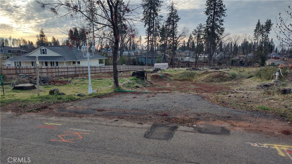 Fantastic Opportunity to Build Your Dream Home in Paradise, CA!
Discover this exceptional residential parcel located in the heart of Paradise, just a short stroll from beautiful Bille Park. Surrounded by stunning new construction, this lot is nestled in a thriving neighborhood that’s quickly becoming one of the most desirable areas in Northern California.
The property features a gentle slope—ideal for a variety of home designs—and a brand-new fence along the eastern property line for added privacy and definition. A few charming touches from the previous home remain, including a vintage cast mailbox, classic lamp, and water pump, adding character and potential to your future build.
The lot previously hosted a 1,216 sq ft, 3-bedroom, 2-bathroom home—offering a great starting point for your building plans.
Whether you're looking to invest or create your forever home, don't miss this opportunity to build in one of California’s fastest-growing and most welcoming communities.