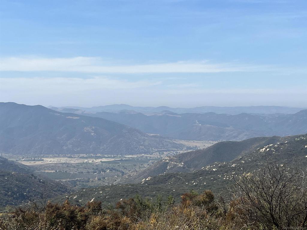 Almost 10 Acres lot in a Gorgeous location to build your dream home in this lovely gated community off Pala Road. Beautiful area looking high up over the Temecula Valley with fabulous views. This area is only minutes from Temecula's Pechanga Casino, Great Oak schools, sports center and lots more. This community has beautiful homes on acreages. There are paved and unpaved roads in spots and in this private community. Water and Electricity available at the site. Water meter reserved, but not in. Perk Test on file. Seller willing to finance with the right offer.