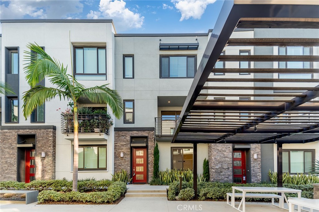 Luxury lives here. Welcome to this charming and cozy little home located in the heart of the Irvine business complex. The first floor features a suite with its own private bathroom. The second floor has an open-concept layout, with the kitchen seamlessly connected to the living room, allowing family members to cook and chat together. The second floor also includes an outdoor balcony for relaxing. The flooring throughout from the first to the second floor is newly installed and very easy to maintain. On the third floor, you'll find three bedrooms and a laundry room, all quiet and comfortable. The house faces the community park, offering a peaceful view and a tranquil atmosphere. Schedule a tour today!