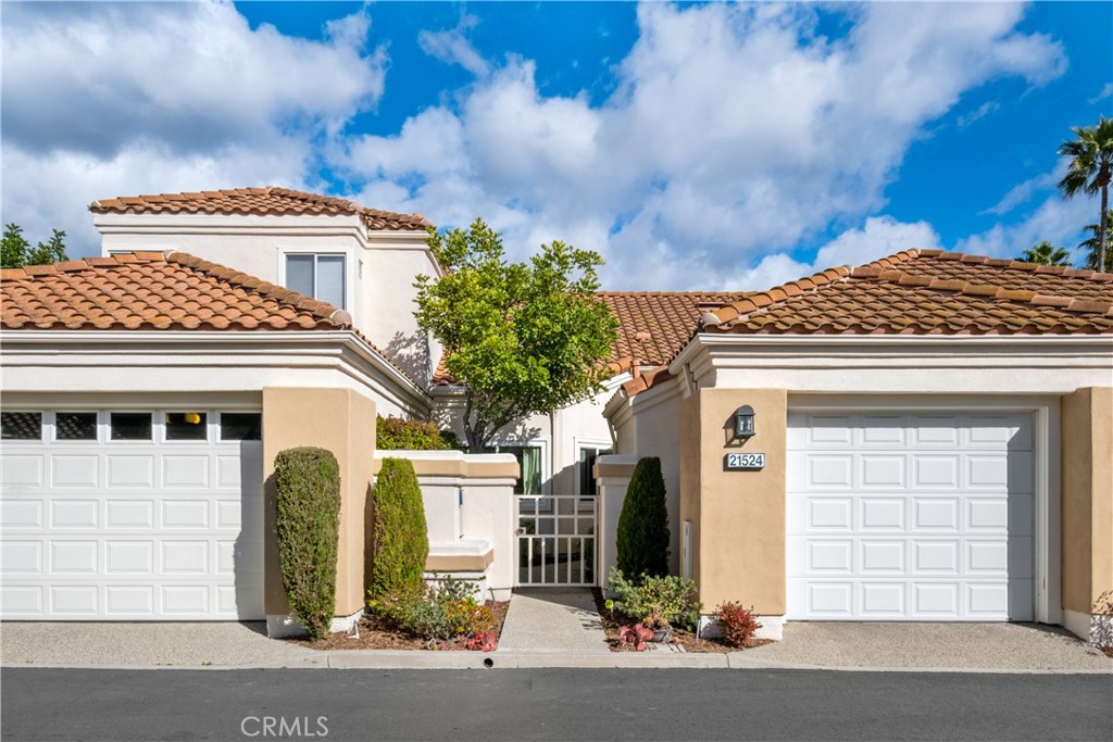 Welcome to this beautifully remodeled single-level home nestled in the highly sought-after, guard-gated 55+ community of Palmia. With 2 bedrooms and 2 bathrooms, this open-concept residence offers both comfort and convenience in a thoughtfully designed layout. The chef’s kitchen is a showstopper, featuring quartz countertops, a large stainless steel sink and appliances, abundant built-in cabinetry, and a sunny breakfast nook. Entertain effortlessly in the dining area that opens to the cozy living room with soaring cathedral ceilings and a stunning fireplace that adds warmth and charm. The spacious primary suite offers a peaceful retreat with a sliding glass door that leads to the manicured back patio. It also features a remodeled en-suite bathroom complete with a double vanity and a walk-in shower. The secondary bedroom is located at the front of the home, offering privacy for guests, with an updated full bathroom conveniently nearby. Additional features include two garage spaces—one with direct access to the kitchen and another detached but just steps away. The home has been repiped and includes newer vinyl windows, custom electric window treatments in the living room, and a newer HVAC system. Step outside to a private patio—ideal for outdoor dining or relaxing in the fresh air. Palmia offers an active lifestyle with exceptional amenities including clubhouses, swimming pools, a spa, tennis and pickleball courts, an 18-hole putting green, a fitness center, and more. Residents also enjoy membership to Lake Mission Viejo, with access to concerts, kayaking, boating, and seasonal events.
Don’t miss the opportunity to live in this vibrant, resort-style community!