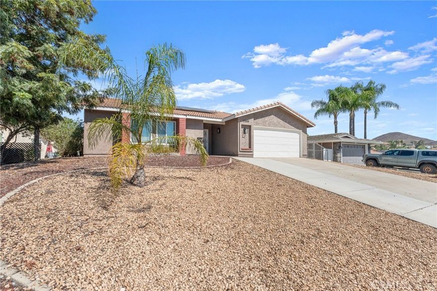 PRICE IMPROVEMENT!!! Seller is MOTIVATED and welcomes ALL Offers!! 3-bedroom, 2-bath home located within walking distance to all community amenities! In the kitchen you will find granite countertops, stainless steel appliances, recessed lighting, and a spacious layout. There are three sliding doors that lead to the backyard providing both convenience and functionality. In the living room there is a fireplace and a built-in cabinet perfect for storage. The large lot is fully fenced with block walls, includes two storage sheds, and offers a covered wood patio with a fan and has a stained concrete slab perfect for entertaining! The highlight's of the property is the PAID-OFF SOLAR , a whole house fan, and the Newly Upgraded PEX PIPE plumbing throughout, providing efficiency and peace of mind. The home offers an excellent opportunity to add your own updates and personal touch! This property is part of a private, 24/7 gated community, and offers a 524-acre lake for boating, water skiing, sailing, and fishing. Additional HOA amenities include pools, clubhouse, tennis, pickleball, equestrian center, SCGA-rated golf course, four beaches, nine parks, amphitheater, and more than 40 community clubs. You will love holidays in this community with  year round parades for all occasions! Enjoy the benefits of LOW TAX RATE and NO MELLO ROOS! Perfect home for first time buyer's! Don't wait to see this one!