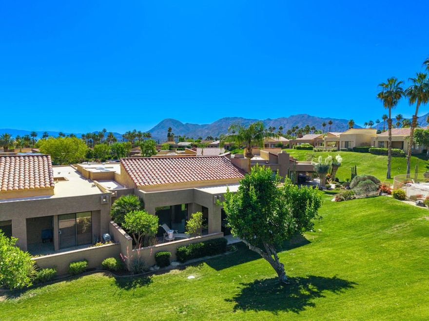 Wonderful, quiet setting at the end of the cul de sac. Very private back yard with views of the mountains, large area of lawns and only a few short steps to the pool and spa. The gated entry leads to a large front patio so you can enjoy the outdoors at both the front and rear of the home. The den has been significantly expanded and offers a 3rd sleeping area. Very open plan. Tall ceilings and lots of windows make the home light and bright.