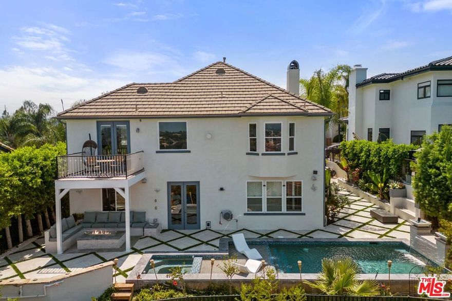 Nestled within the exclusive gated "Medina Estates" with unobstructed 180-degree views of the San Fernando Valley, welcome to this fully renovated, open, and bright 5bd/ 4.5ba, 3,591sf home situated on a 8,884sf lot atop a quiet cul-de-sac. The spacious primary bedroom features a cozy fireplace, a private balcony with stunning views, and ample closet with built-ins. Step outside to a charming courtyard featuring a full service outdoor kitchen & bar, large pool with integrated spa, outdoor speakers, multiple fire pits, and custom stone made built-in seating. Large 3 car garage with newly upgraded epoxy flooring. Rental price includes ALL utilities