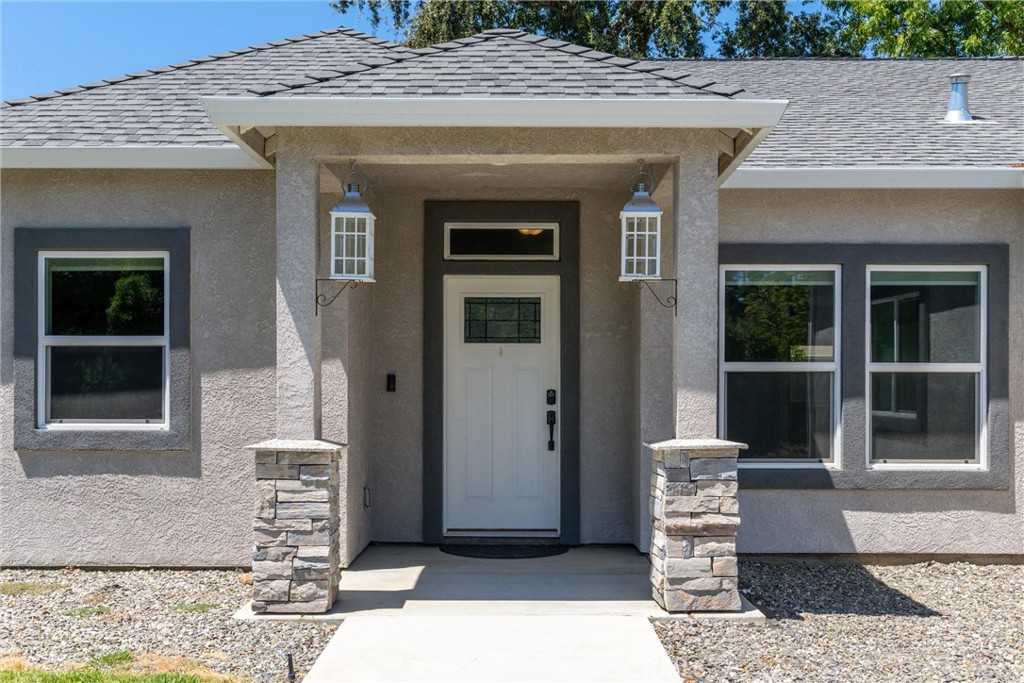 Offered at $440,000, this home was professionally constructed in 2020. This well maintained 4 bedroom, 2 bath stunner is situated on a large corner lot with alley access and RV parking. At 1,817 square feet, the interior design of this beautiful home doesn’t disappoint. It sports a variety of amenities that include an open floor plan with 9 foot ceilings throughout. The kitchen has shaker style cabinets with soft close drawers and doors, granite counter tops, a large kitchen island with bar seating, a reverse osmosis water filtration system, an outdoor shower area, remote controlled electric fireplace, and a walk-in pantry that was quality crafted. Another desirable feature of this home is the split floor plan with the master bedroom on one side and the other 3 bedrooms situated on the other side of home. The master bedroom has a spacious walk-in closet and a master bathroom with dual sinks, granite counter tops, and walk-in shower. The main bath has granite counter tops, tile tub/shower which is heated by an on demand hot water system. The home has stainless steel appliances throughout, in addition to a camera system, Ring Camera, and a Nest thermostat which are all included. Step out back and you’ll find more than enough room to spread out and enjoy the peace and quiet of the neighborhood. The concrete patio spans 1,716 square feet that wraps around the home to give you plenty of room to entertain and space for RV parking. Buyer to verify all information to their satisfaction. Don’t miss out, this one won’t last long!