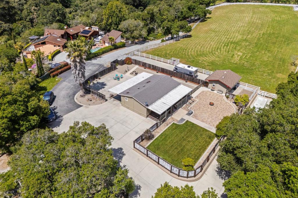Welcome to Loma Alta Estate, a private 19.65-acre ranch in Santa Cruzs exclusive Old Pilkington Rd community. This gated sanctuary borders DeLaveaga Golf Course & Santa Cruz Shakespeare, just 10 mins from Hwy 1, Hwy 17 & local beaches. Above the fog line, the property offers sunny mornings, manicured pastures, mature oaks, a private road, and cross-fencing. The 2,400 sq ft remodeled barn features 4 stalls, tack room, wash stall, hay storage, loft, offices & half bath. A 3BR/2BA caretakers home w/ guest quarters, outdoor kitchen, patio & fenced yard adds charm and flexibility. Zoned AG/Special Use, with 2 productive wells, underground utilities & extensive hardscaping. A legacy property rich in character with endless opportunities such as equestrian use, future estate development through land division, or family compound and all located within minutes to town creates this unique offering. This amazing property has been in the same family for the past 55 years and it's now your chance to own one of Santa Cruz last luxurious ranches.
