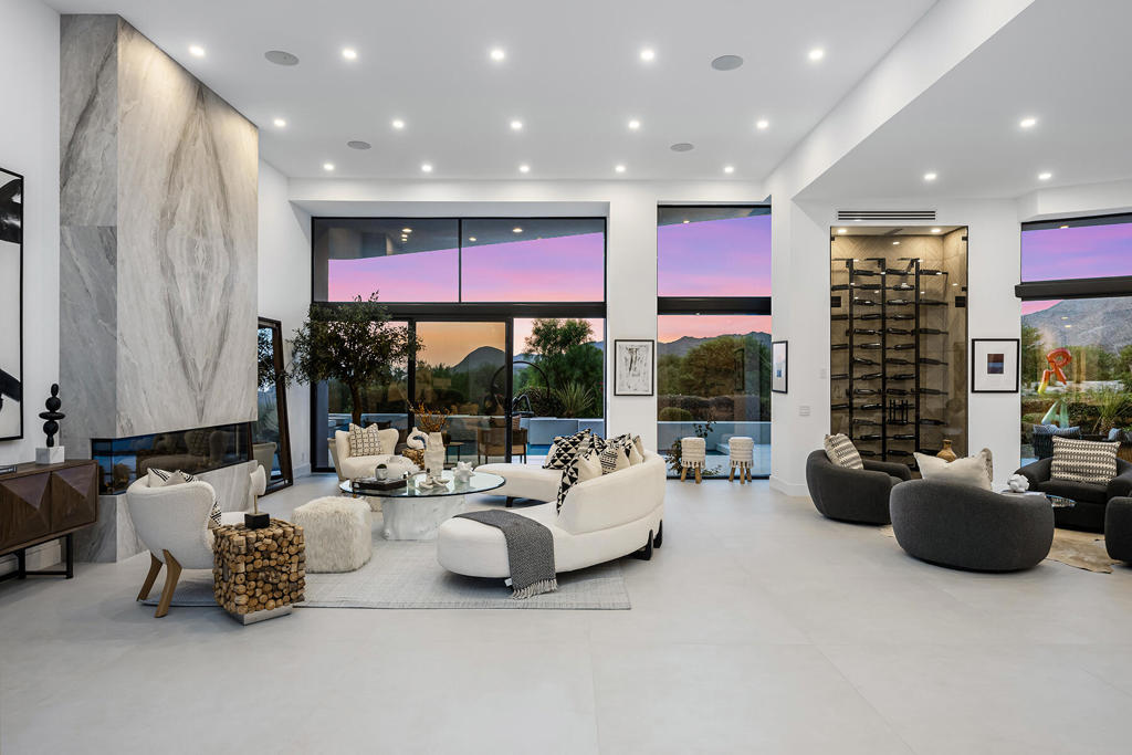 This exquisite, fully remodeled residence is ideally situated on the 16th hole of BIGHORN's prestigious Mountain Course, offering sweeping views of the golf course and the majestic Eisenhower Mountain beyond.Meticulously designed and offered furnished, this custom home features 4 spacious bedrooms and 4.5 elegantly appointed bathrooms. A private, gated courtyard with lush, mature landscaping provides a warm and tranquil welcome.Upon entering through double glass doors, you're immediately captivated by contemporary, sophisticated finishes and unobstructed panoramic views of the surrounding mountains and the expansive outdoor living area. The open-concept great room showcases a stunning book-matched fireplace and designer furnishings. Adjacent to the great room, a cozy conversation area and temperature-controlled wine storage create an inviting space for entertaining.The formal dining room is perfectly positioned to overlook the outdoor entertainment patio and breathtaking vistas beyond. The chef's kitchen is a true culinary haven, outfitted with premium Decor appliances, a custom breakfast bar with seating for six, two multifunctional sinks, and a built-in Decor coffee machine.The serene primary suite features a cozy fireplace, a relaxing sitting area, direct access to the spa, and awe-inspiring mountain views. The luxurious spa-inspired primary bathroom boasts dual vanities, a generous shower with multiple rain heads and hand-held fixtures, and a beautiful