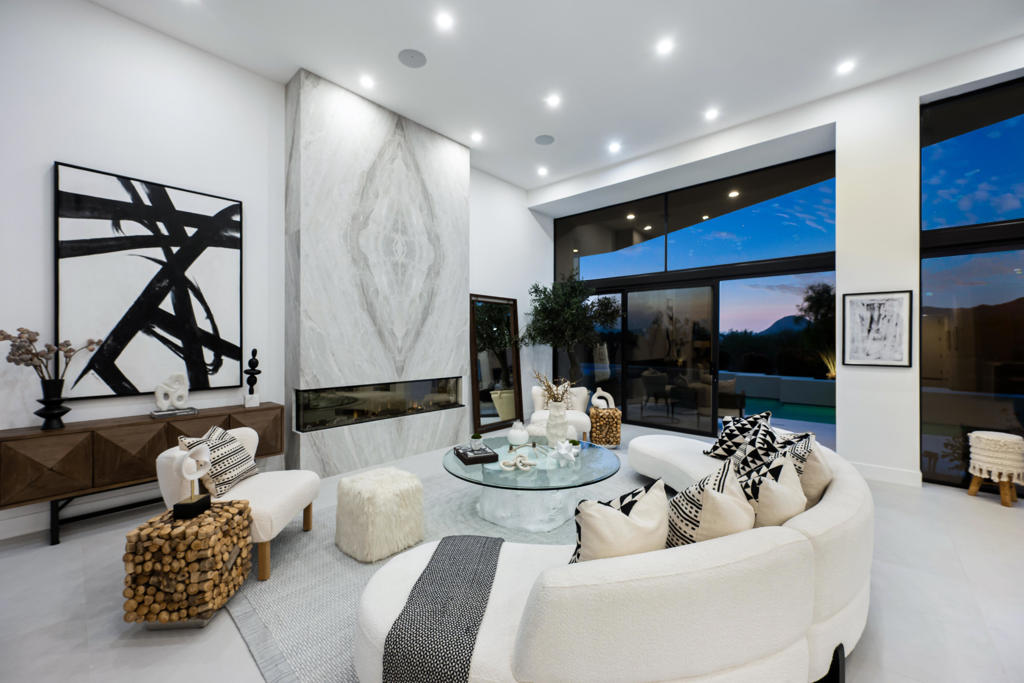 This exquisite, fully remodeled residence is ideally situated on the 16th hole of BIGHORN's prestigious Mountain Course, offering sweeping views of the golf course and the majestic Eisenhower Mountain beyond.Meticulously designed and offered furnished, this custom home features 4 spacious bedrooms and 4.5 elegantly appointed bathrooms. A private, gated courtyard with lush, mature landscaping provides a warm and tranquil welcome.Upon entering through double glass doors, you're immediately captivated by contemporary, sophisticated finishes and unobstructed panoramic views of the surrounding mountains and the expansive outdoor living area. The open-concept great room showcases a stunning book-matched fireplace and designer furnishings. Adjacent to the great room, a cozy conversation area and temperature-controlled wine storage create an inviting space for entertaining.The formal dining room is perfectly positioned to overlook the outdoor entertainment patio and breathtaking vistas beyond. The chef's kitchen is a true culinary haven, outfitted with premium Decor appliances, a custom breakfast bar with seating for six, two multifunctional sinks, and a built-in Decor coffee machine.The serene primary suite features a cozy fireplace, a relaxing sitting area, direct access to the spa, and awe-inspiring mountain views. The luxurious spa-inspired primary bathroom boasts dual vanities, a generous shower with multiple rain heads and hand-held fixtures, and a beautiful